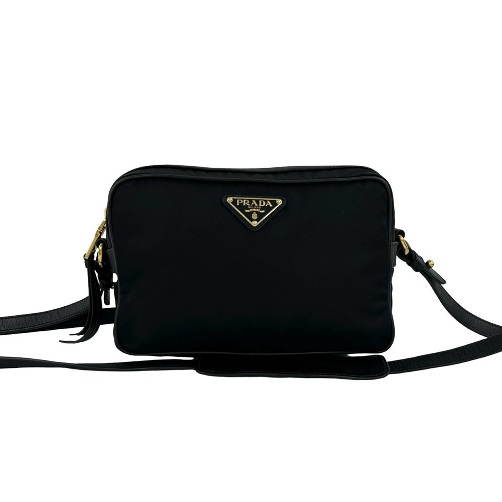 PRADA mini shoulder bag/pouch in black, featuring a triangular logo hardware ...